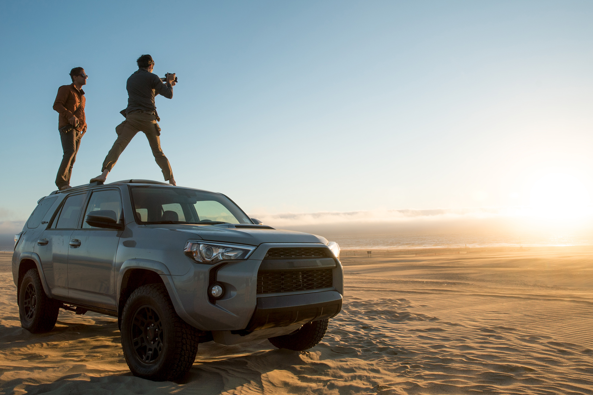 Standing on vehicle filming in Australian desert